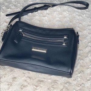 A black Kenneth Cole purse.